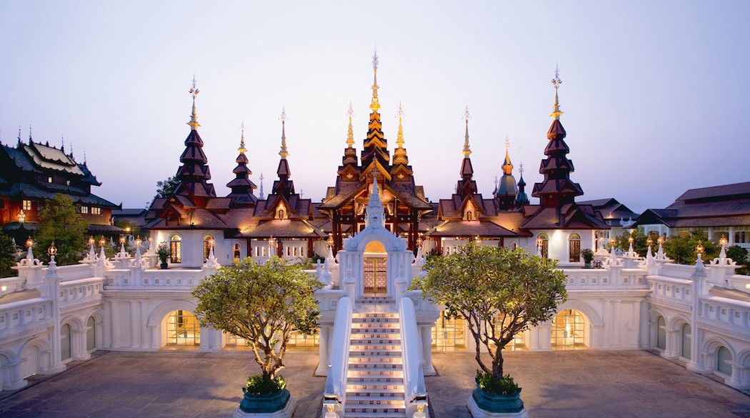 A cluster of iconic Thai spires reaching out to the skies welcome guests at Dhera Dhevi Chiang Mai.