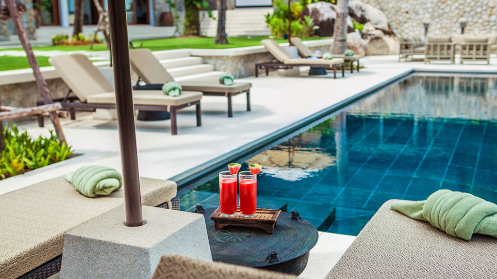 sunbeds by the pool at Villa Analaya in Phuket