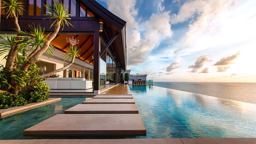 swimming pool sunset shot of Villa Paradiso in Phuket